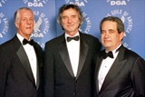 DGA President Michael Apted and National Executive Director Jay D. Roth with 2003 Honoree Curtis Hanson (center).