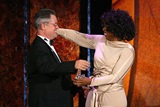 Winfrey presents Demme with the DGA Honors crystal eagle & a big hug. (Photo by Matthew Peyton/Getty Images)