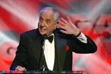 Director Garry Marshall listens for love from the audience, as he prepares to present the 2004 Franklin J. Schaffner Achievement Award to DGA Awards Associate Director Peery Forbis. 