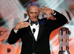 Eastwood models for his Lifetime Achievement Award.