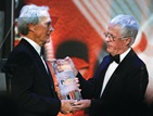 Clint Eastwood accepts DGA Lifetime Achievement Award from DGA President Michael Apted.