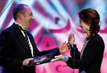Barry Sonnenfeld accepts the DGA Comedy Series Award from presenter Debra Messing.