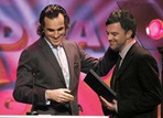 Daniel Day-Lewis presents the feature film nomination plaque to Paul Thomas Anderson.