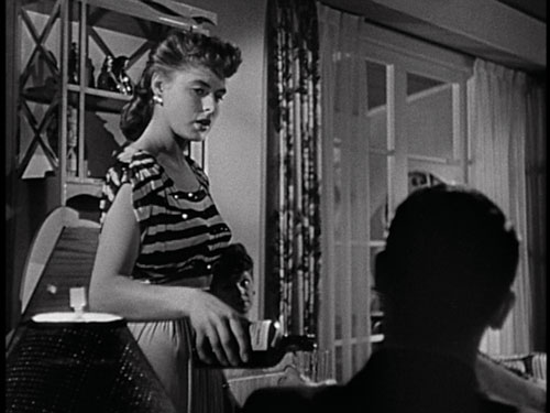  FLIRT: Party girl Ingrid Bergman meets Cary Grant in the film's opening scene, but the audience only sees his back. - Screenpull: RKO/The Criterion Collection - click link for IMDB info